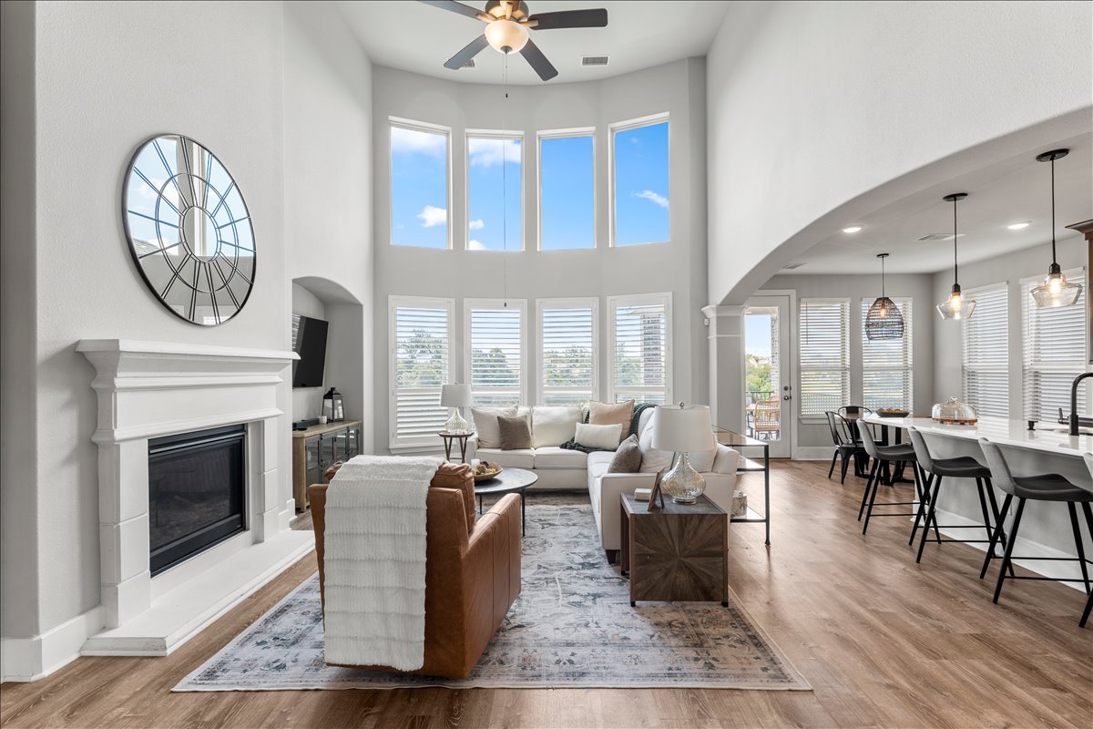 200 Draco Street Georgetown, TX 78628 - Photo 5 of 39 a living room with furniture a large window and a fireplace