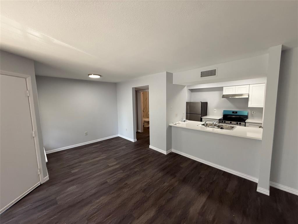 12482 Abrams Road, Unit 1427 Dallas, TX 75243 - Photo 3 of 10 a kitchen with a sink and cabinets