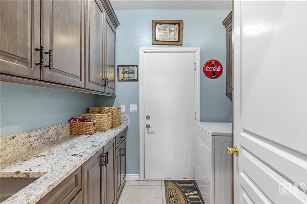 Undisclosed Address Tehachapi, CA 93561 - Photo 11 of 29 a room with granite countertop a refrigerator and a sink