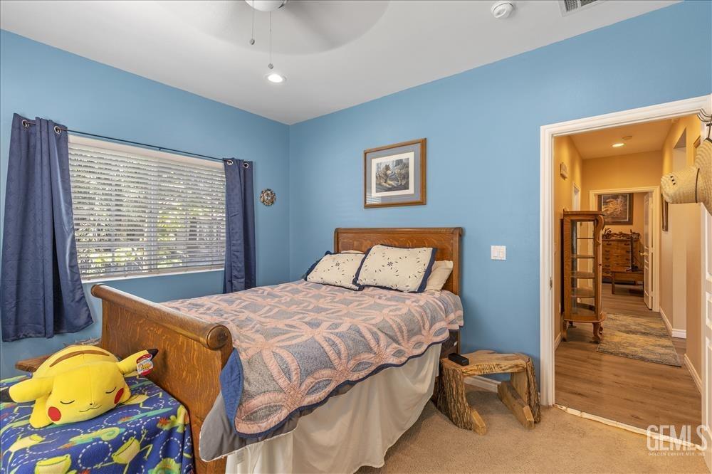 Undisclosed Address Tehachapi, CA 93561 - Photo 13 of 29 a bedroom with a bed and a dresser