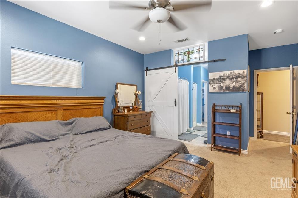 Undisclosed Address Tehachapi, CA 93561 - Photo 19 of 29 a bedroom with a bed and dresser