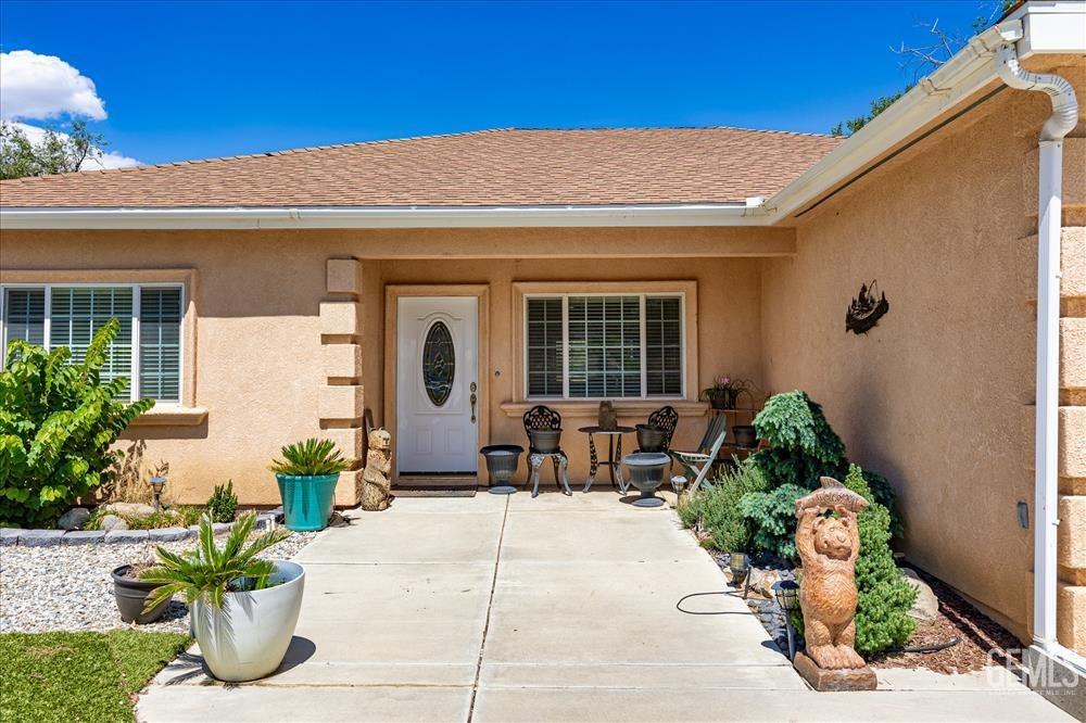 Undisclosed Address Tehachapi, CA 93561 - Photo 2 of 29 a front view of a house with potted plants