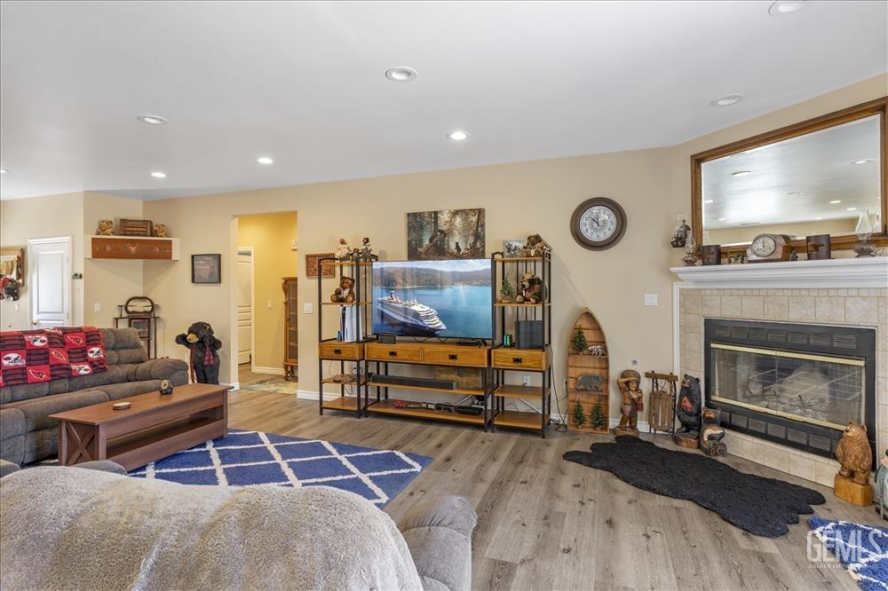 Undisclosed Address Tehachapi, CA 93561 - Photo 5 of 29 a living room with furniture a flat screen tv and a fireplace