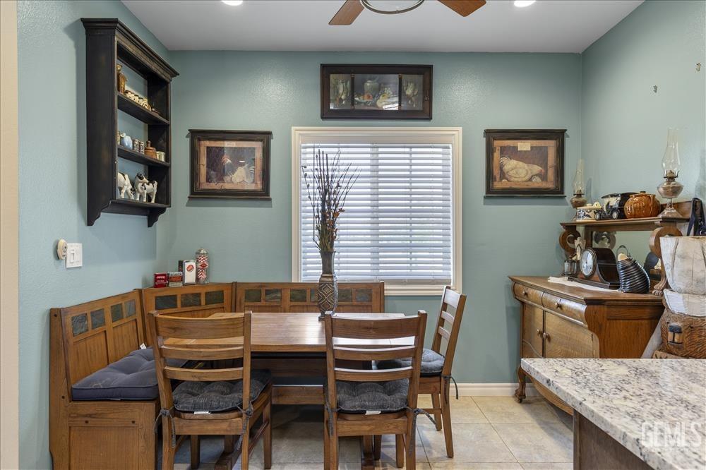 Undisclosed Address Tehachapi, CA 93561 - Photo 8 of 29 a dining room with a table chairs and a wooden floor