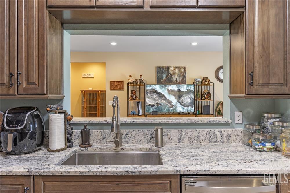 Undisclosed Address Tehachapi, CA 93561 - Photo 10 of 29 a kitchen with granite countertop a sink and cabinets