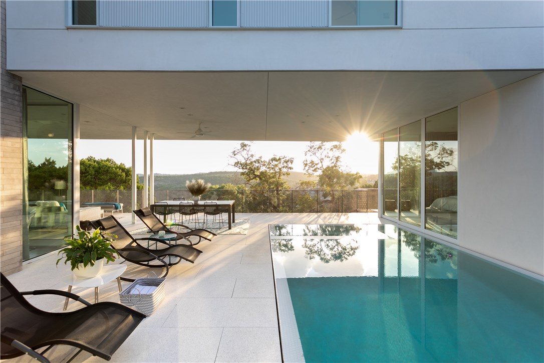 1505 The High Road Austin, TX 78746 - Photo 1 of 1 a view of a patio with swimming pool