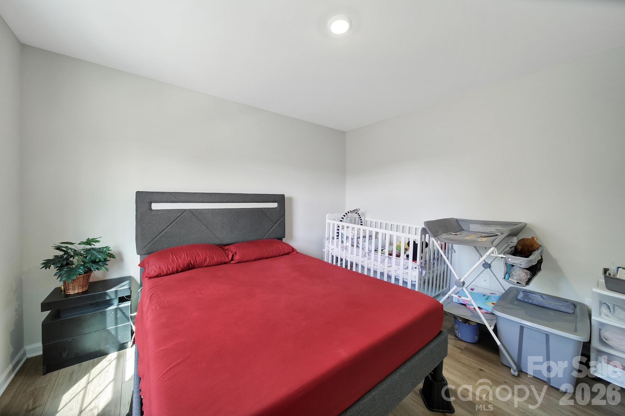 657 Mile Crk Road Edgemoor, SC 29712 - Photo 18 of 40 a bedroom with a bed and a potted plant