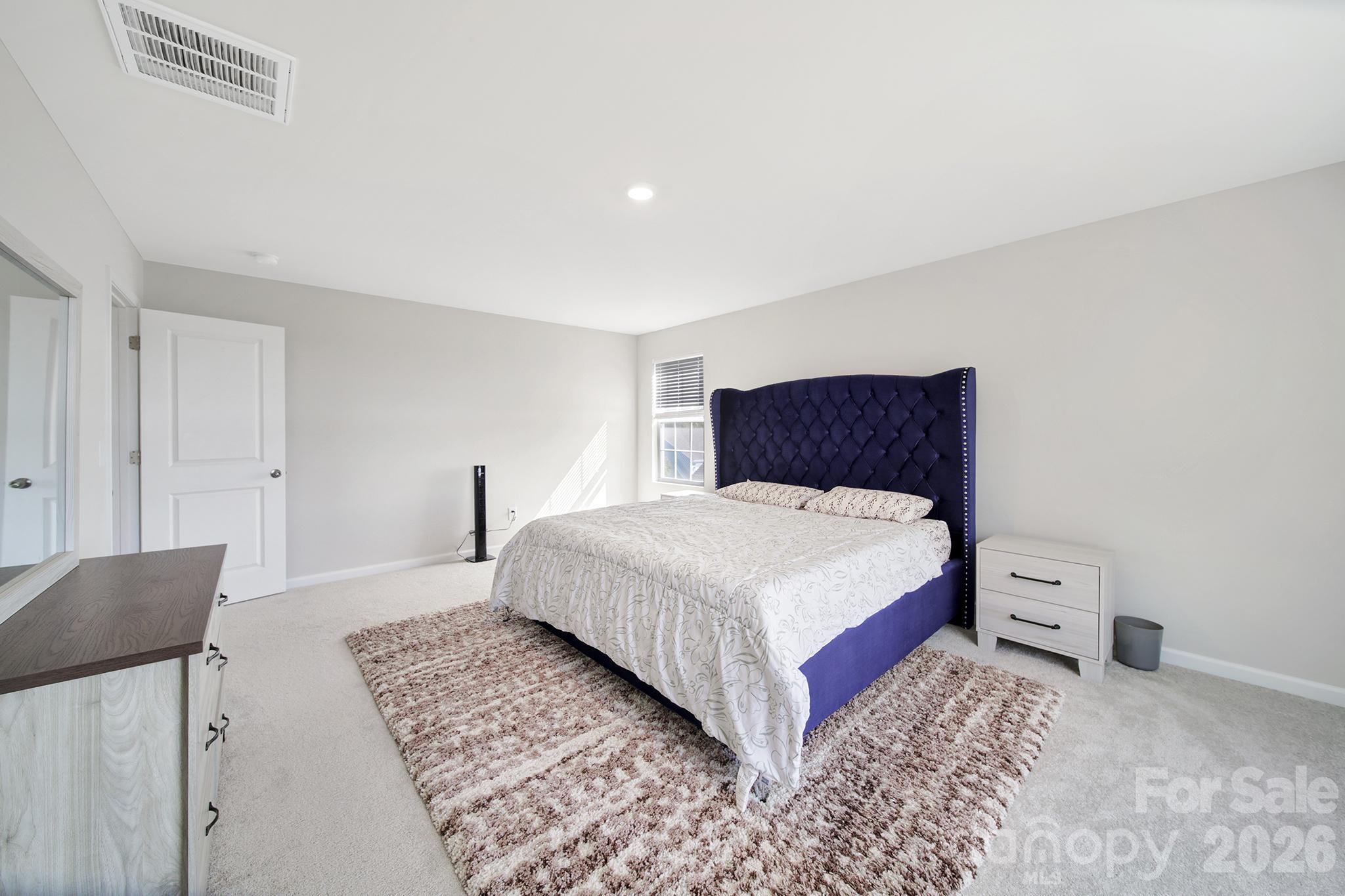 657 Mile Crk Road Edgemoor, SC 29712 - Photo 24 of 40 a bedroom with a bed and a night stand