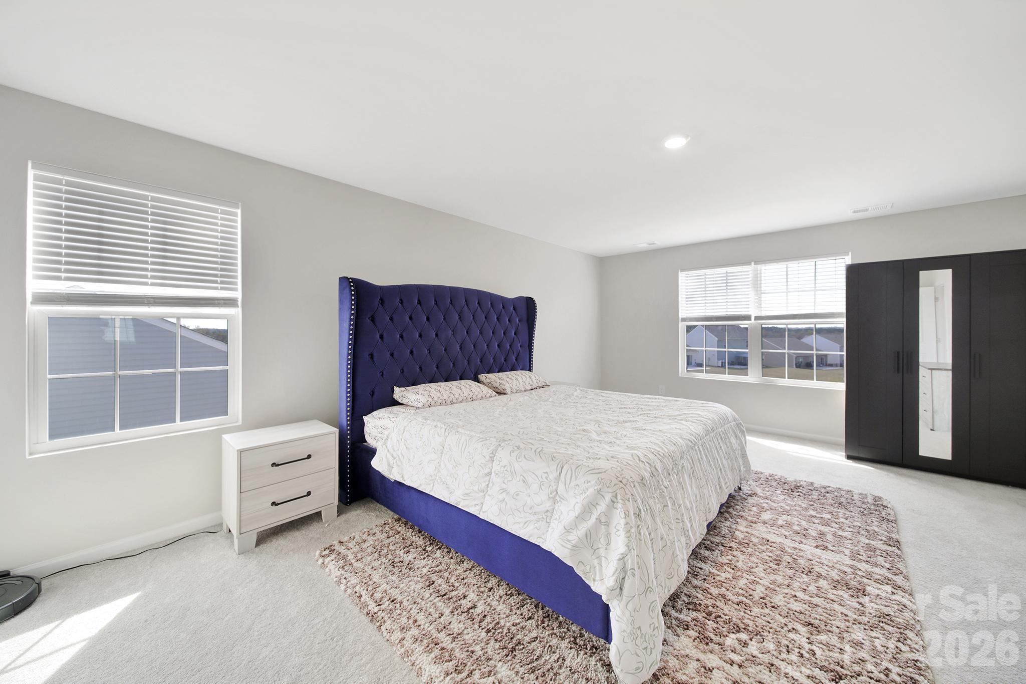 657 Mile Crk Road Edgemoor, SC 29712 - Photo 25 of 40 a bedroom with a large bed and a window