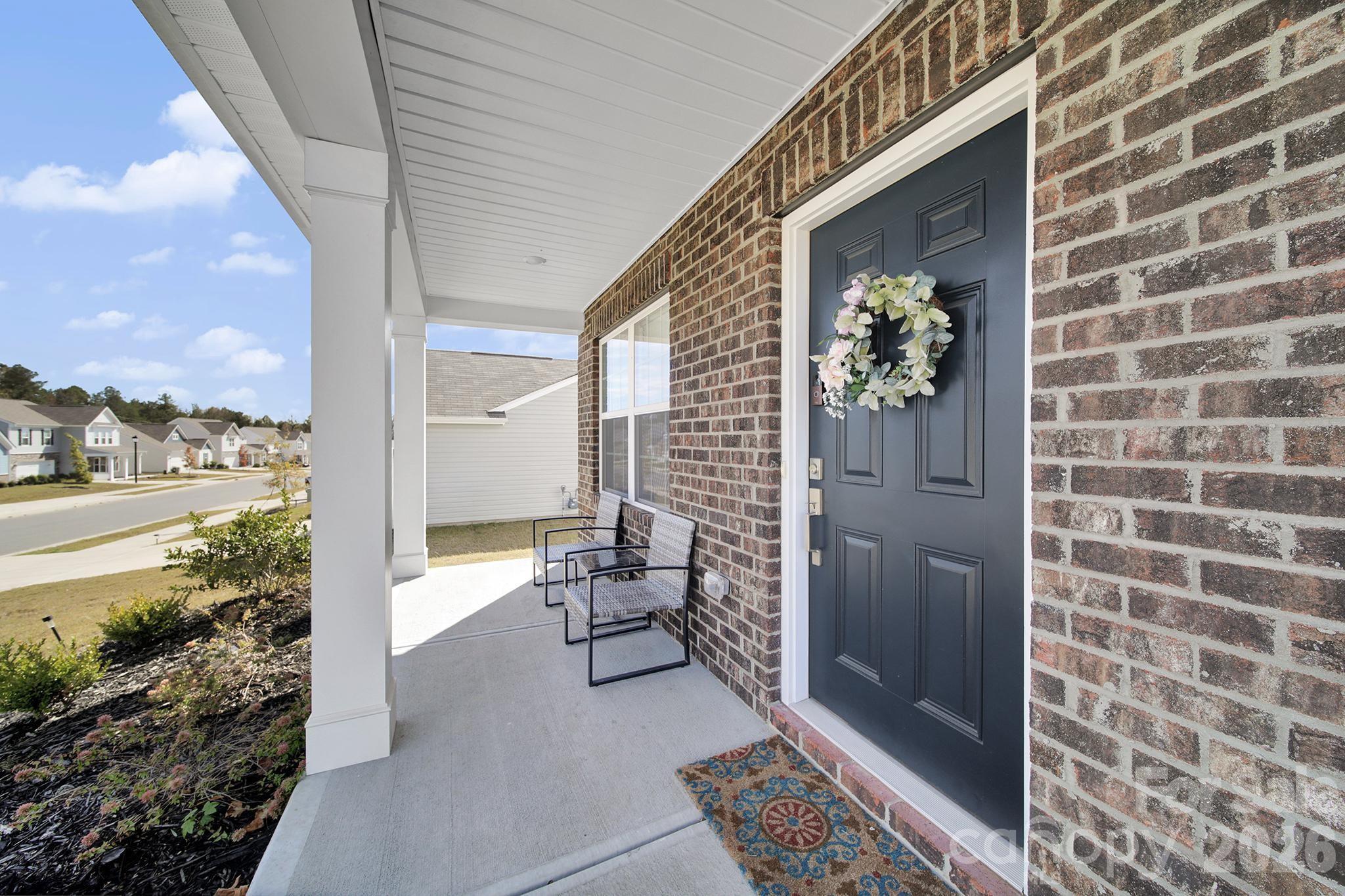 657 Mile Crk Road Edgemoor, SC 29712 - Photo 7 of 40 a view of a balcony with chair and table