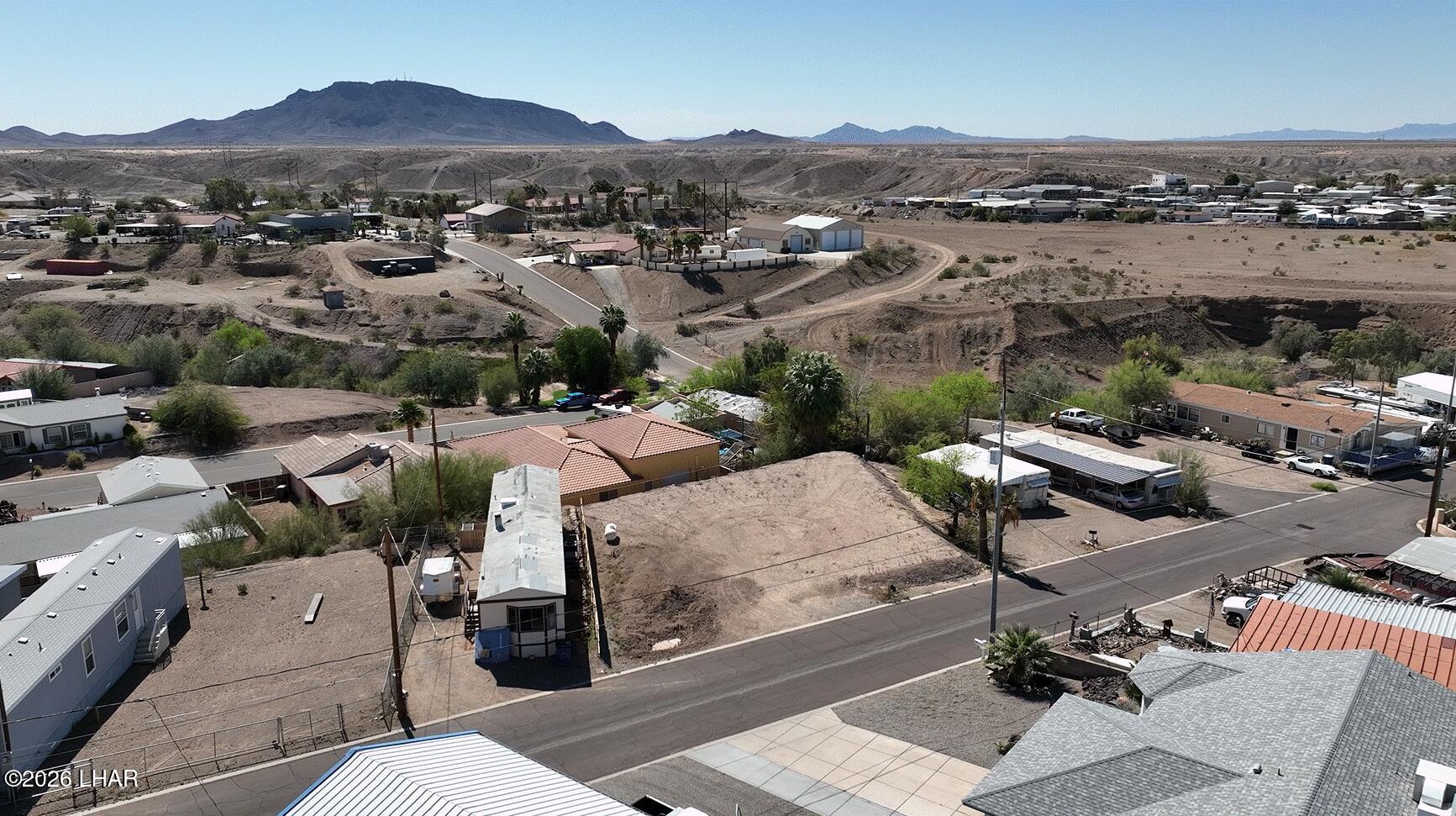 31846 Treasure Road Parker, AZ 85344 - Photo 3 of 13 an aerial view of a houses with a yard