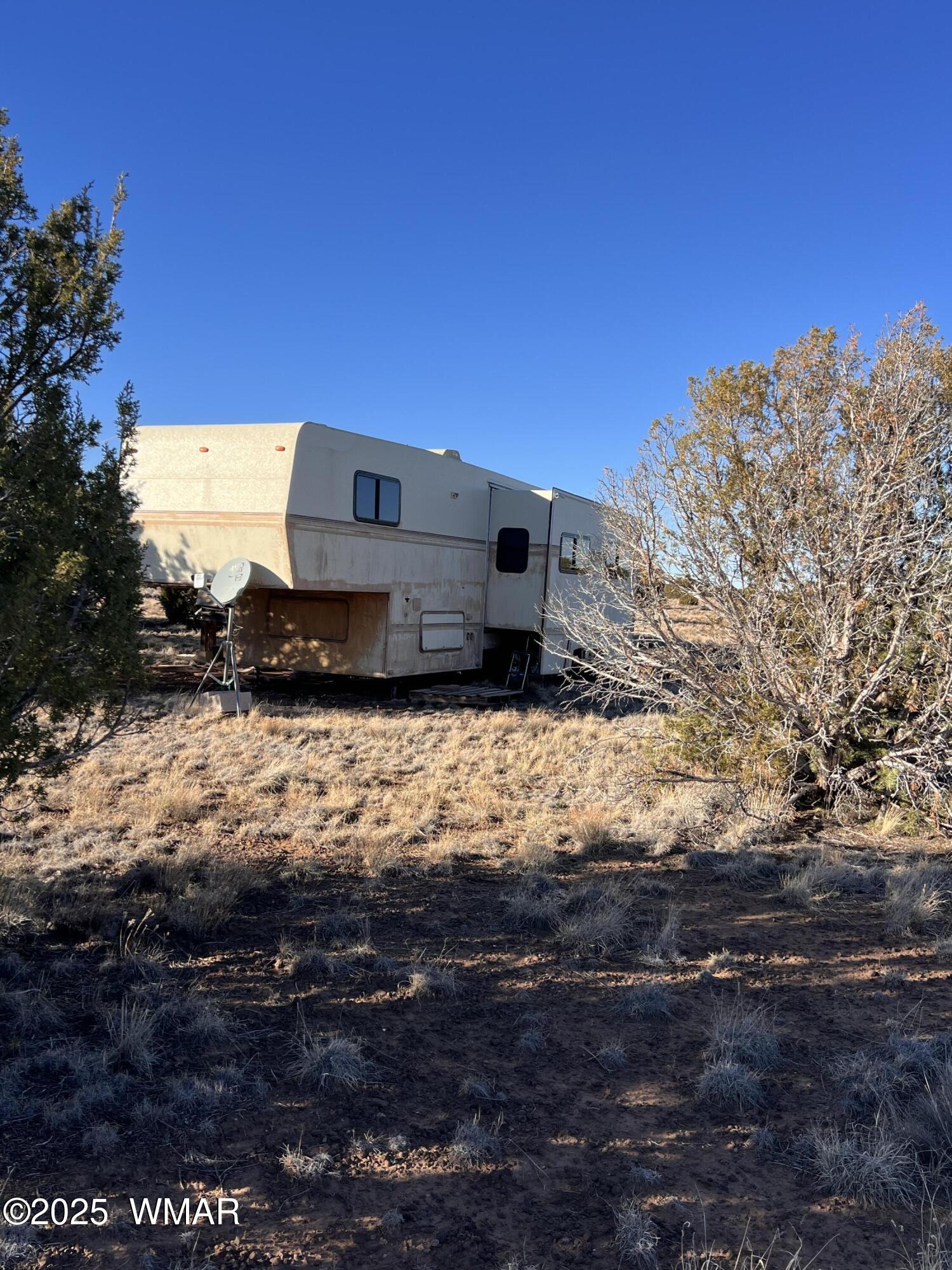14 N3111, Unit A Vernon, AZ 85940 - Photo 14 of 14 a view of a house with a yard
