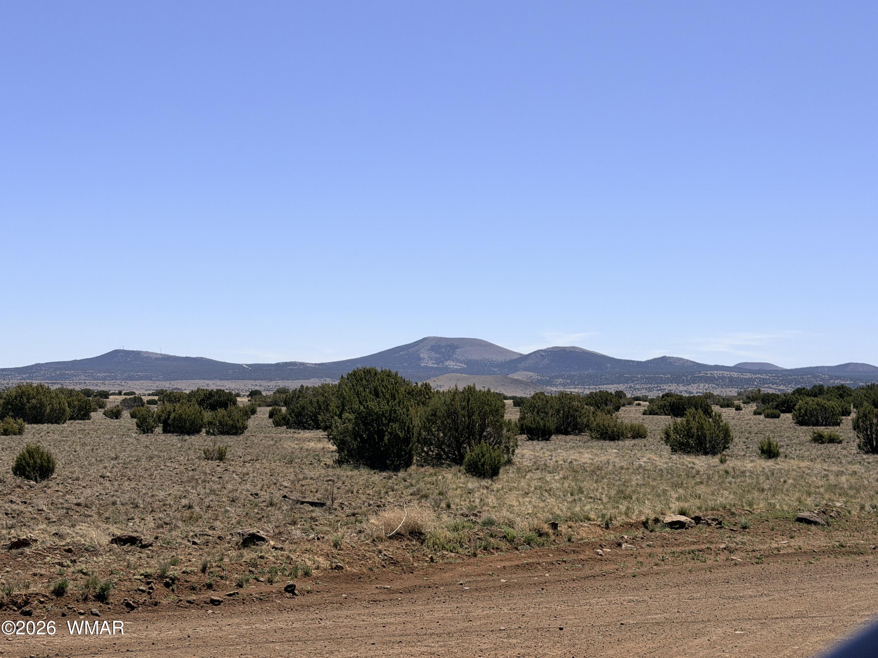14 N3111, Unit A Vernon, AZ 85940 - Photo 7 of 14 a view of a road with mountains in the background