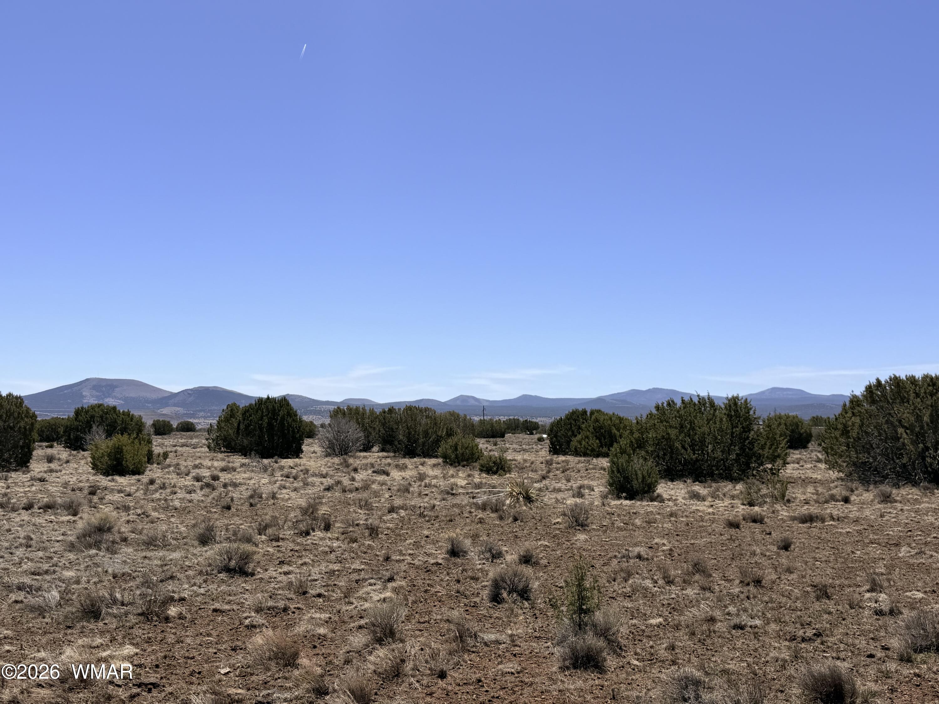 14 N3111, Unit A Vernon, AZ 85940 - Photo 10 of 14 a view of a dry yard with wooden fence