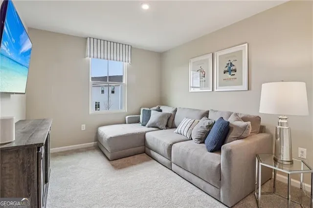 a spacious bedroom with a large bed and a chandelier