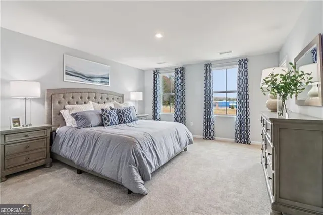 a bedroom with a bed and a dresser