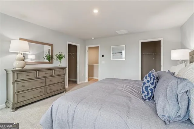 a bathroom with a sink toilet vanity and shower