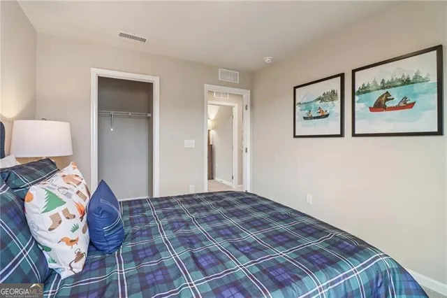 a bedroom with a bed and dresser