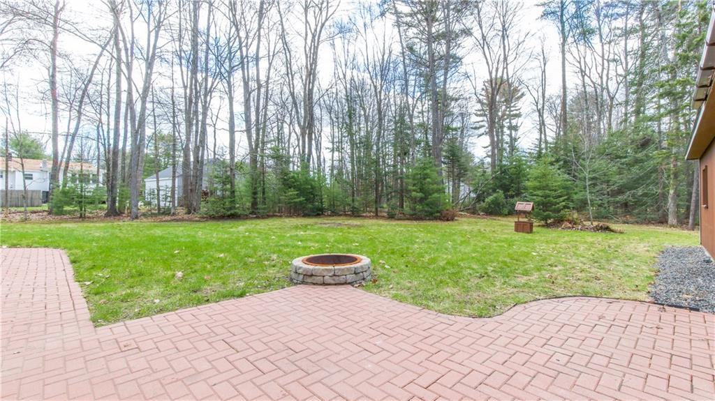 Big back yard with fire pit. ...