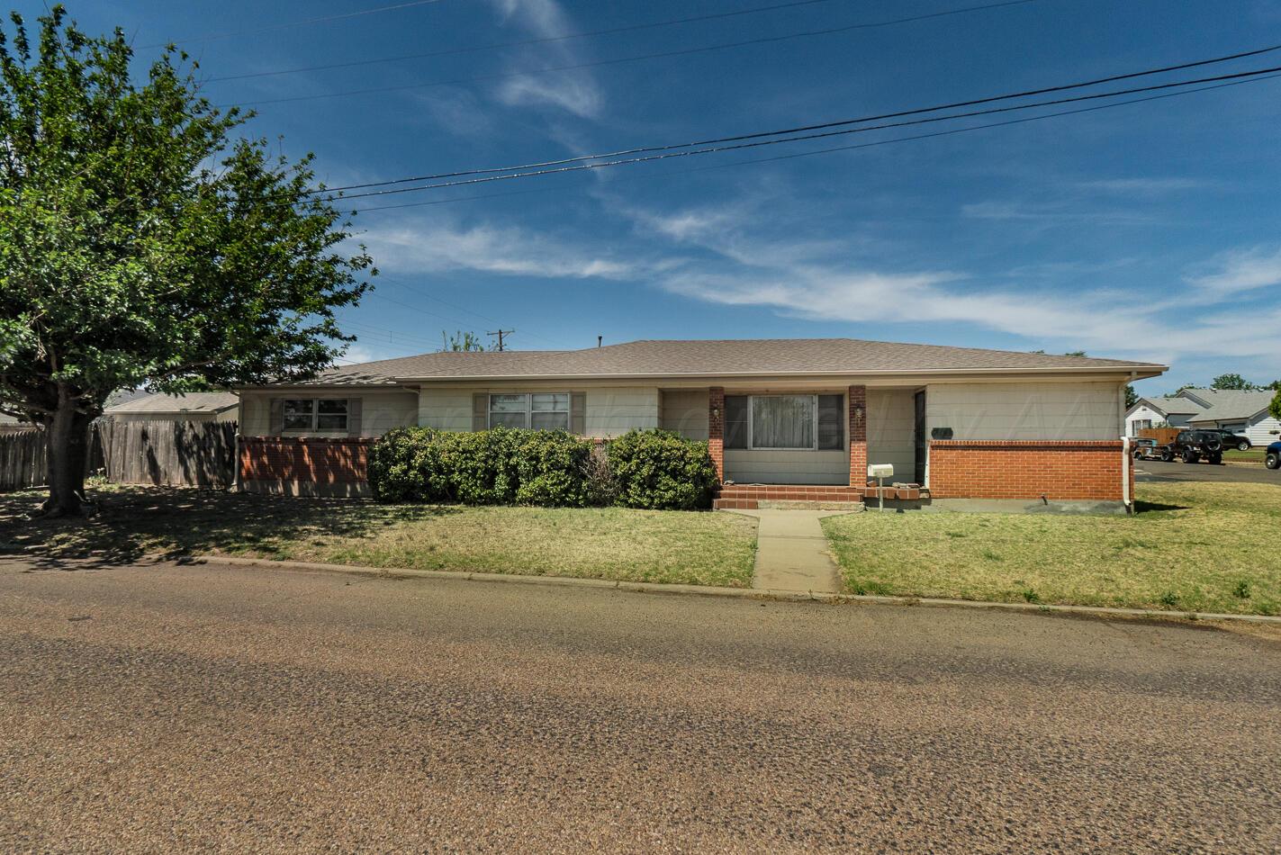 300 Mccarthy Street Borger, TX 79007 - Photo 1 of 31 a front view of a house with a yard and garage