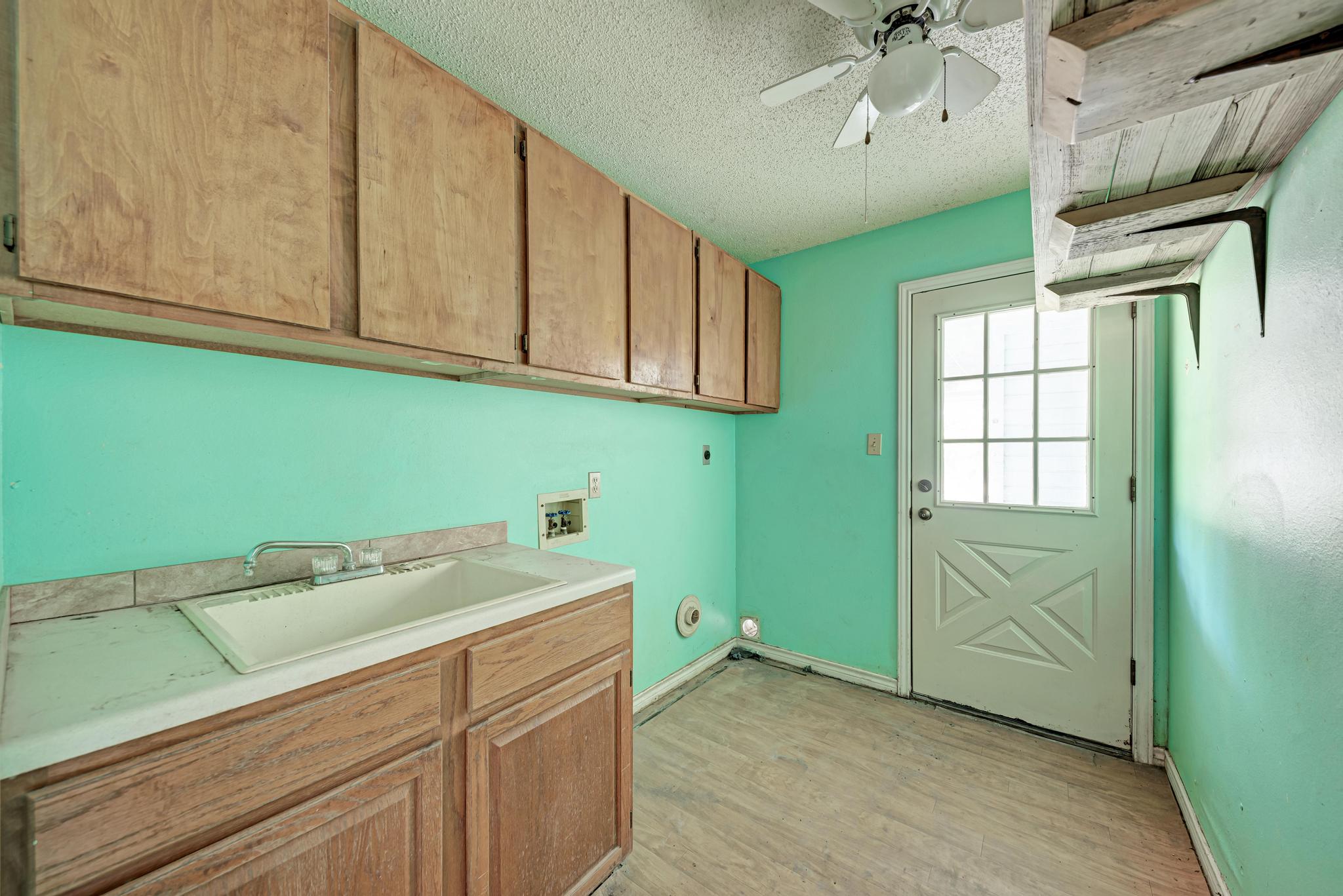 17505 Hamilton Pool Road Austin, TX 78738 - Photo 38 of 38 The in home laundry room is spacious with exterior access.