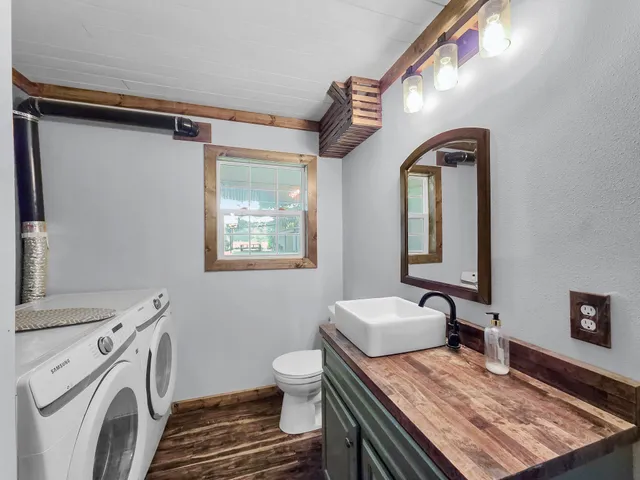 a bedroom with a bed and a table in it