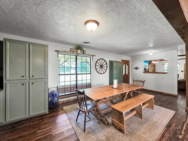 a room with furniture and wooden floor