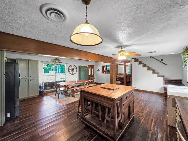 an open kitchen with a table and chairs