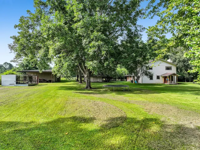 a view of a house with a big yard