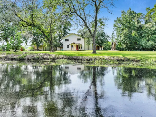 a view of lake with a fountain