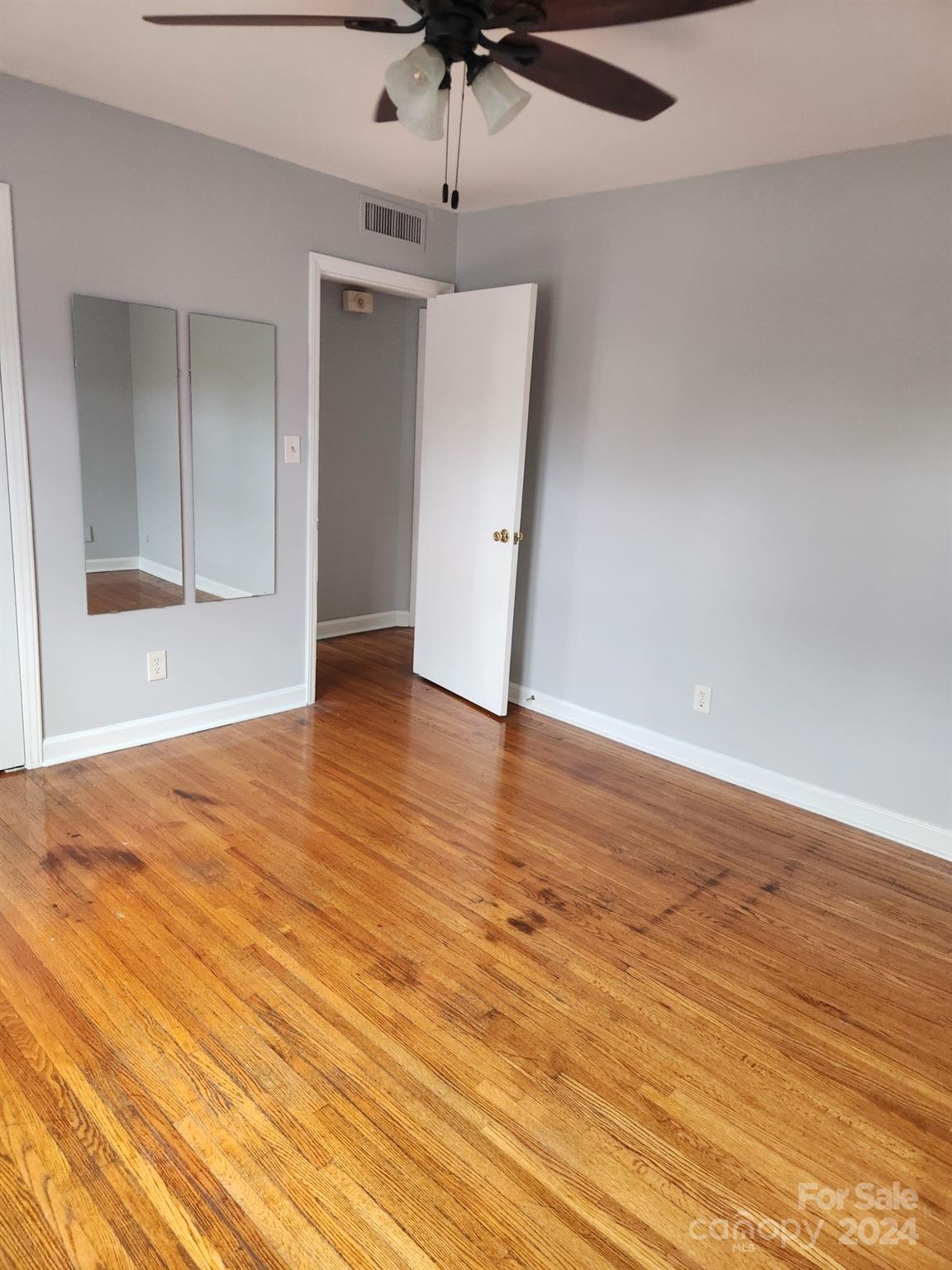 910 McAlway Road, Unit C Charlotte, NC 28211 - Photo 6 of 10 wooden floor in an empty room