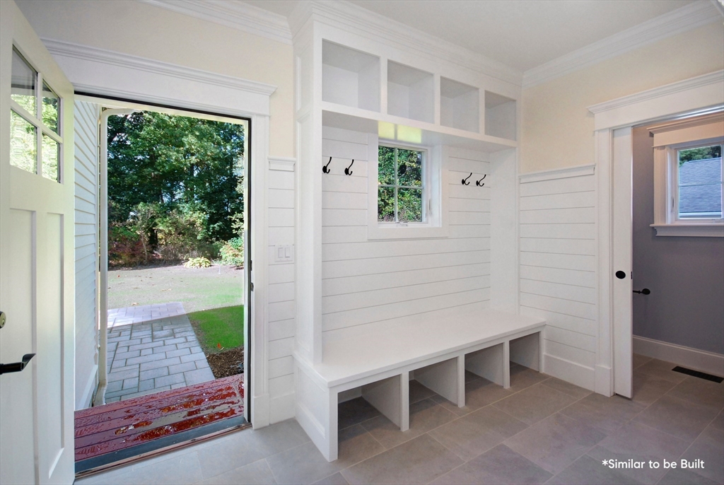 54 Maple Street Concord, MA 01742 - Photo 12 of 27 a room that has a bench in it