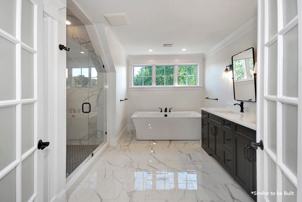 54 Maple Street Concord, MA 01742 - Photo 17 of 27 a bathroom with a tub sink and mirror