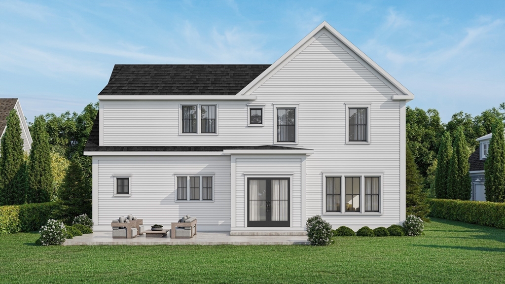 54 Maple Street Concord, MA 01742 - Photo 22 of 27 a front view of a house with a yard