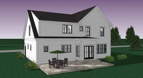 a view of a white house with a yard