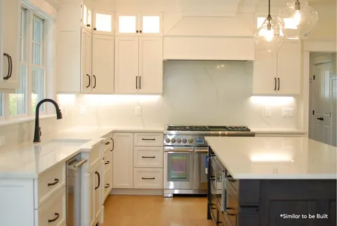 a kitchen with a stove a sink and a refrigerator