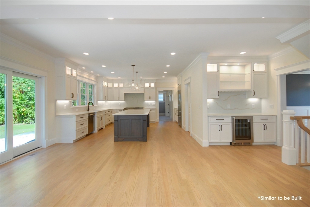 54 Maple Street Concord, MA 01742 - Photo 5 of 27 a large white kitchen with a large window