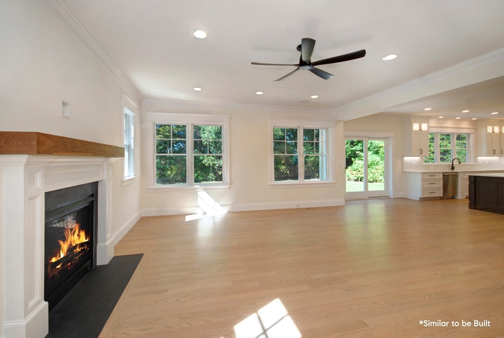 54 Maple Street Concord, MA 01742 - Photo 9 of 27 a view of an empty room with window and fire place