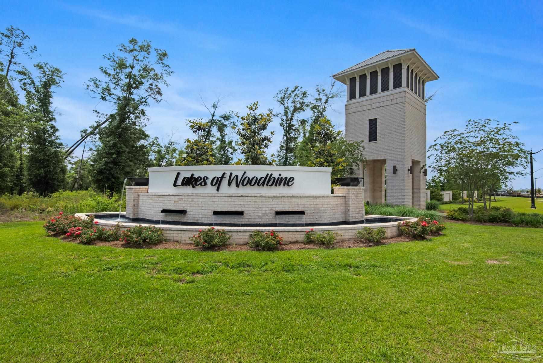 4739 Eider Road Pace, FL 32571 - Photo 20 of 30 a view of a house with a yard and sitting area