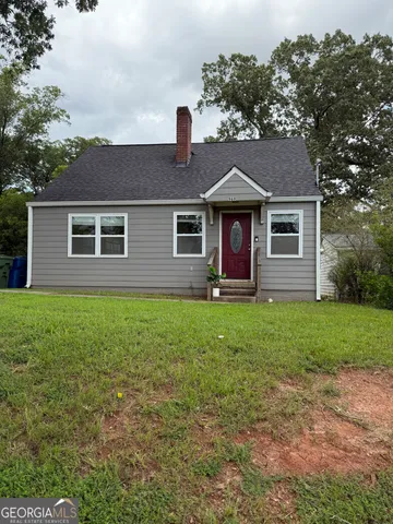 front view of a house with a yard