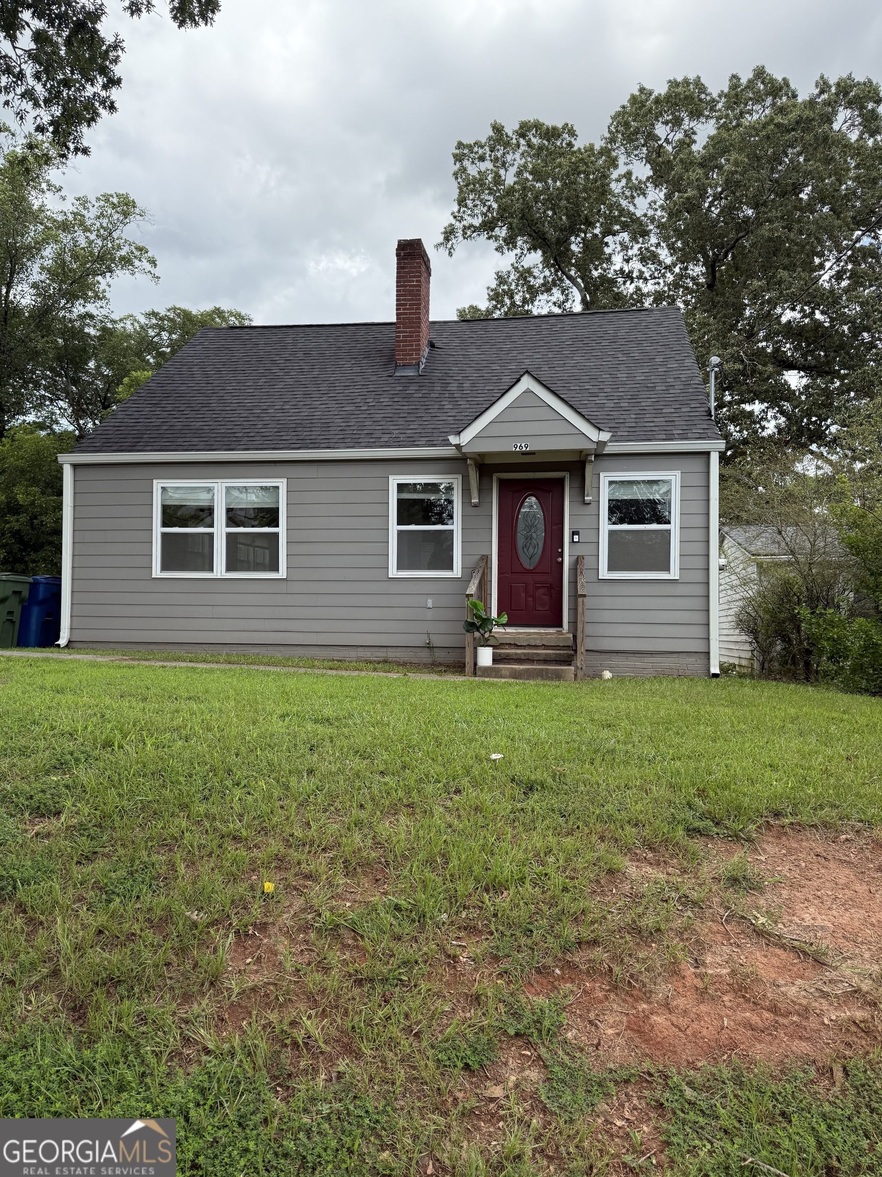 front view of a house with a yard