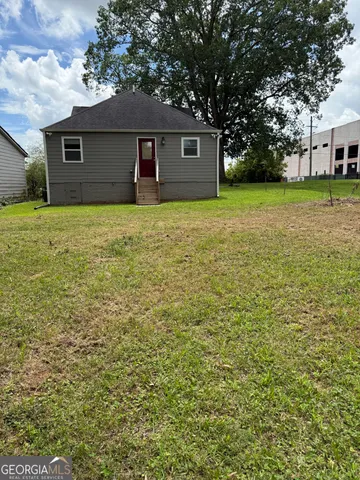 a house view with a garden space