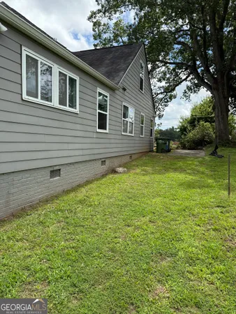 a backyard of a house with lots of green space