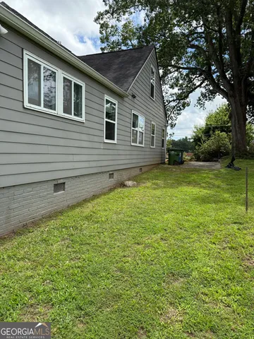 a backyard of a house with lots of green space