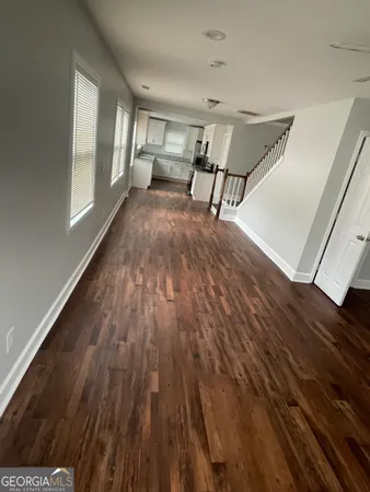 a view of a livingroom with furniture and wooden floor