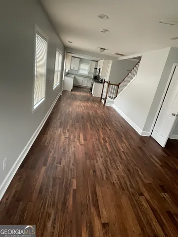 a view of a livingroom with furniture and wooden floor
