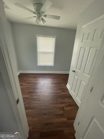 a view of an entryway with wooden floor