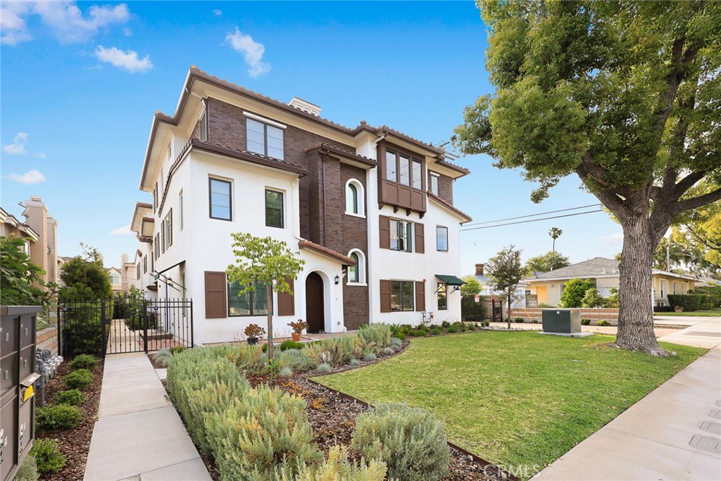 905 Sunset Boulevard, Unit A Arcadia, CA 91007 - Photo 2 of 35 a front view of a house with a yard
