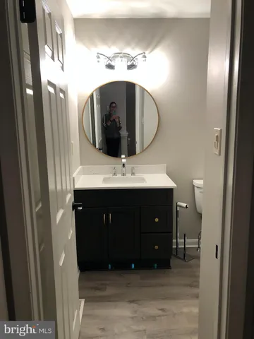 a bathroom with a sink double vanity and a mirror
