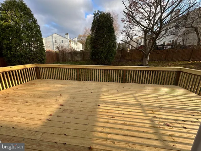 a view of outdoor space with deck and a yard